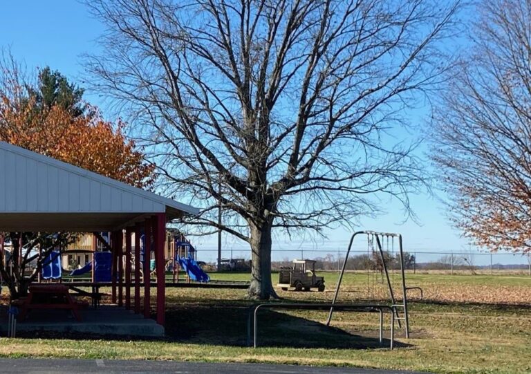 park with picnic tables and playground equipment